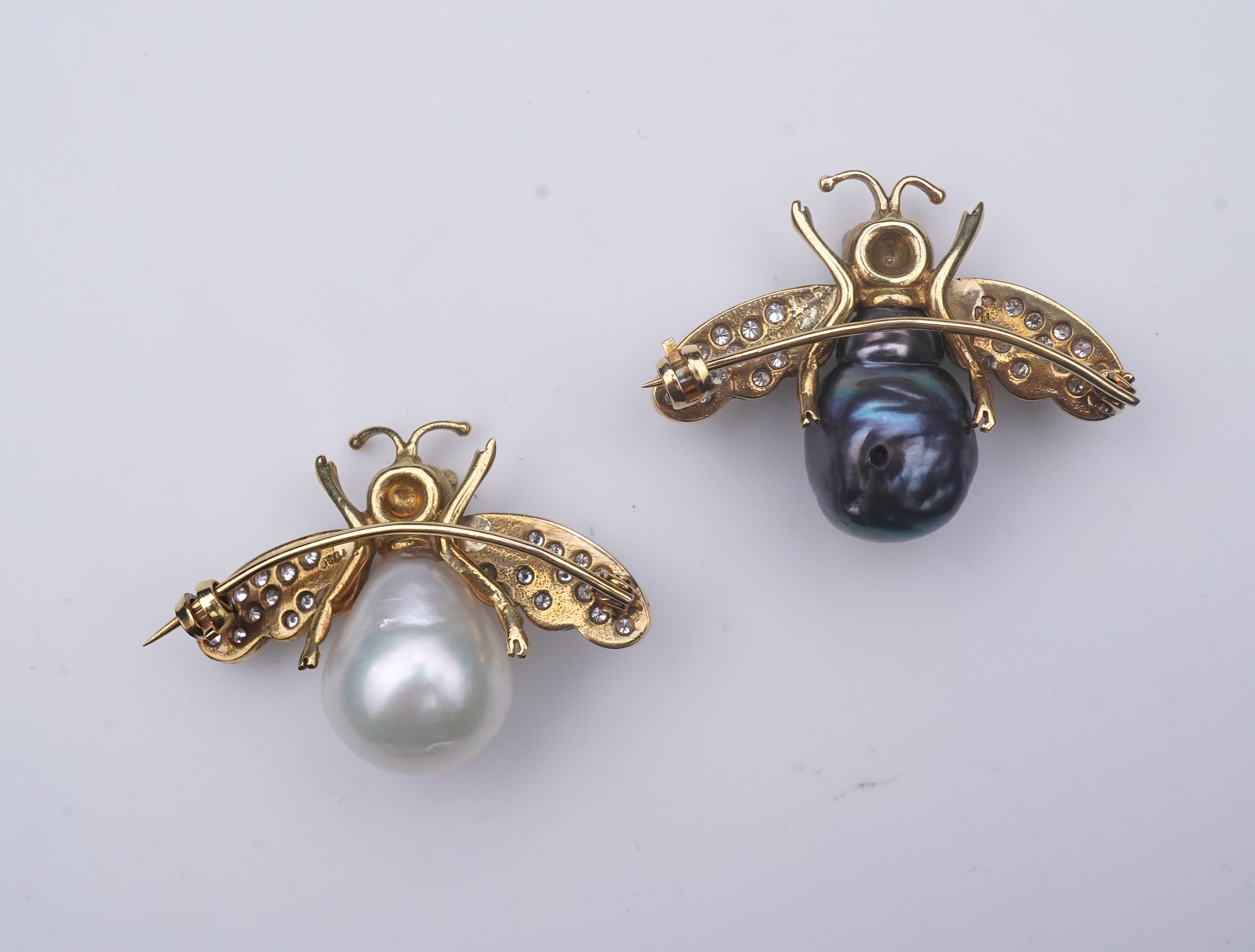 Deakin & Francis, a pair of 18ct gold, cultured pearl and diamond brooches